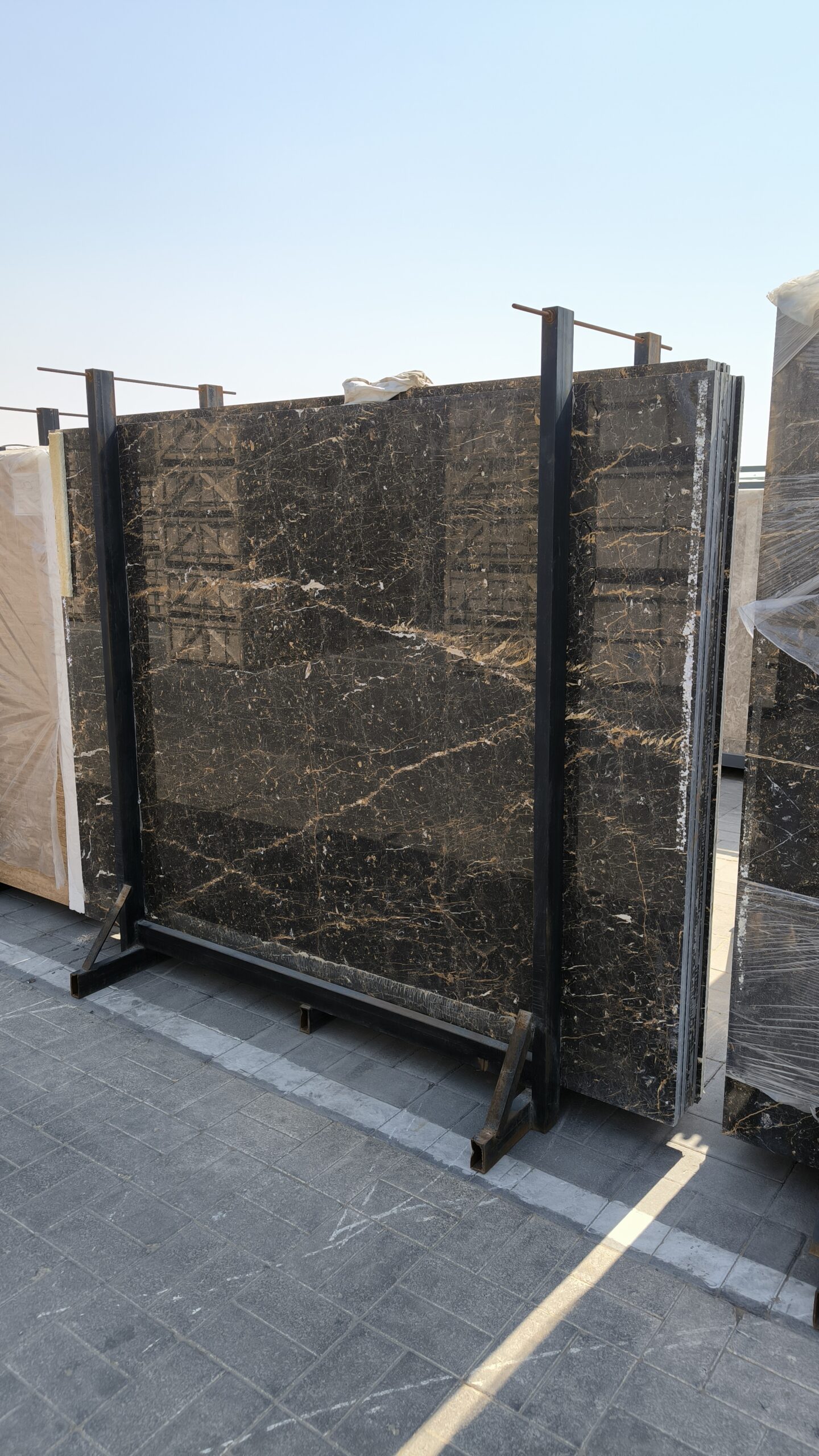 High-quality Golden Black Marble slab displaying a deep black background with striking white lines and random golden flakes.