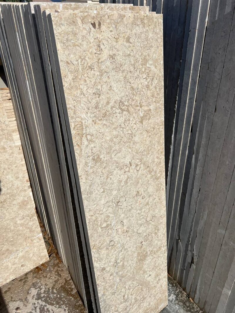 Imperial Marble - Lazulite Marble High-quality Imperial Marble slab displaying a warm cream background intersected by dynamic, chaotic veining in beige and brown tones.
