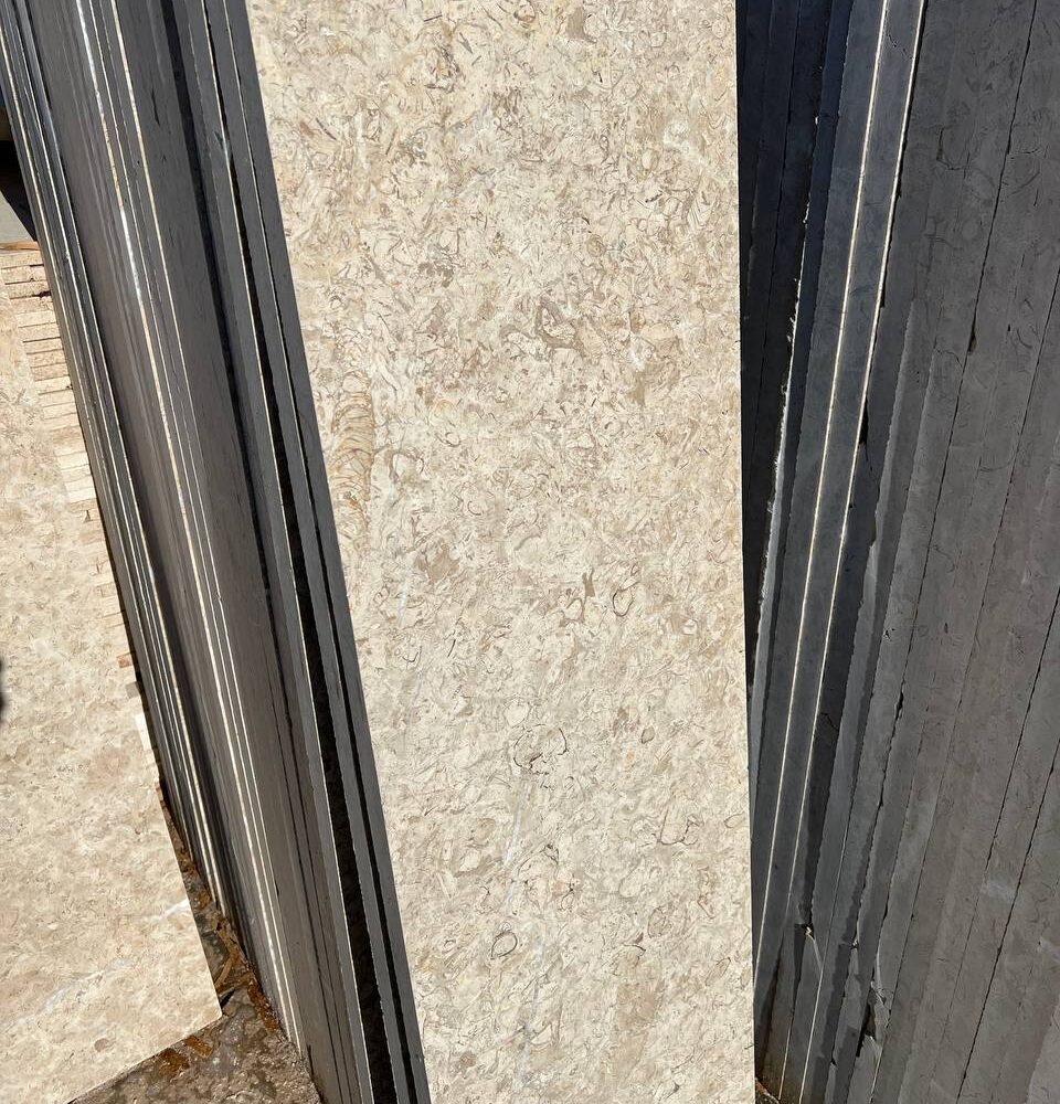 Imperial Marble - Lazulite Marble High-quality Imperial Marble slab displaying a warm cream background intersected by dynamic, chaotic veining in beige and brown tones.